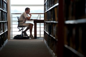 graduate student studying in library