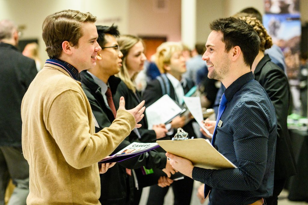 Two students discussing during the career fair.