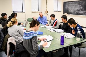 Professor talking with a group of students