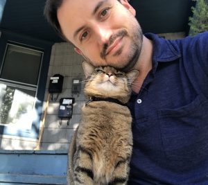 Jason Nolen with a cat.