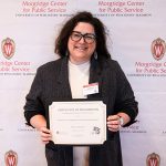 Molly-Clark-Barol receiving her award.